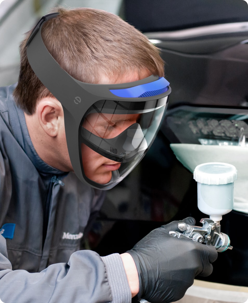 A varnisher wearing the embrace mask while doing a paint job